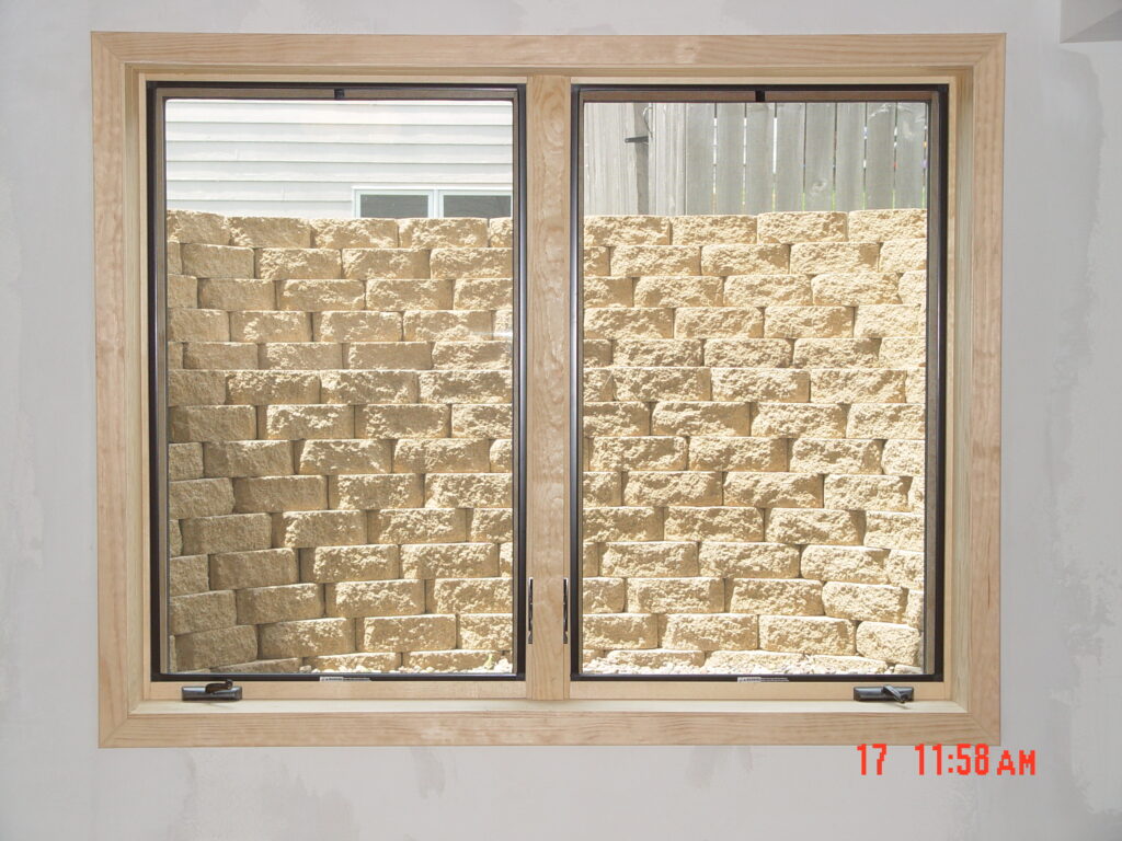 An egress window is added to a basement by a window contractor
